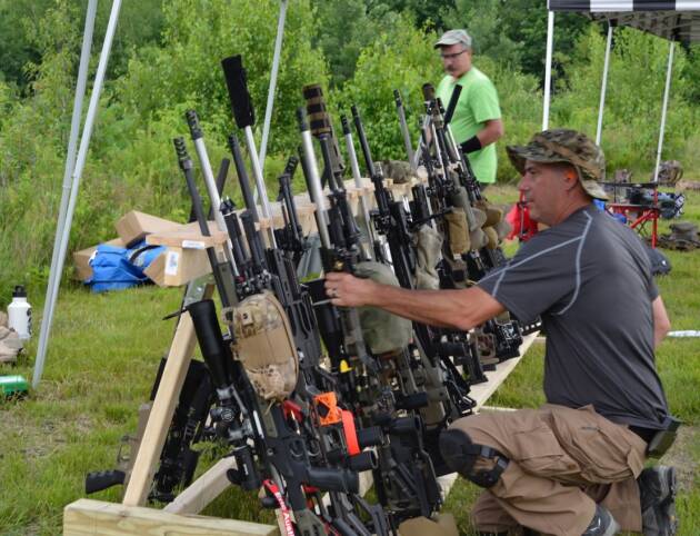 PRS Shooter Getting Rifle from rack